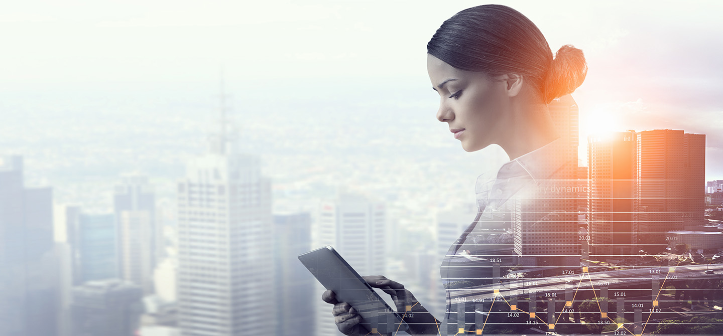 woman looking at tablet