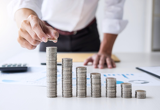 a man adding coins in increasing pattern