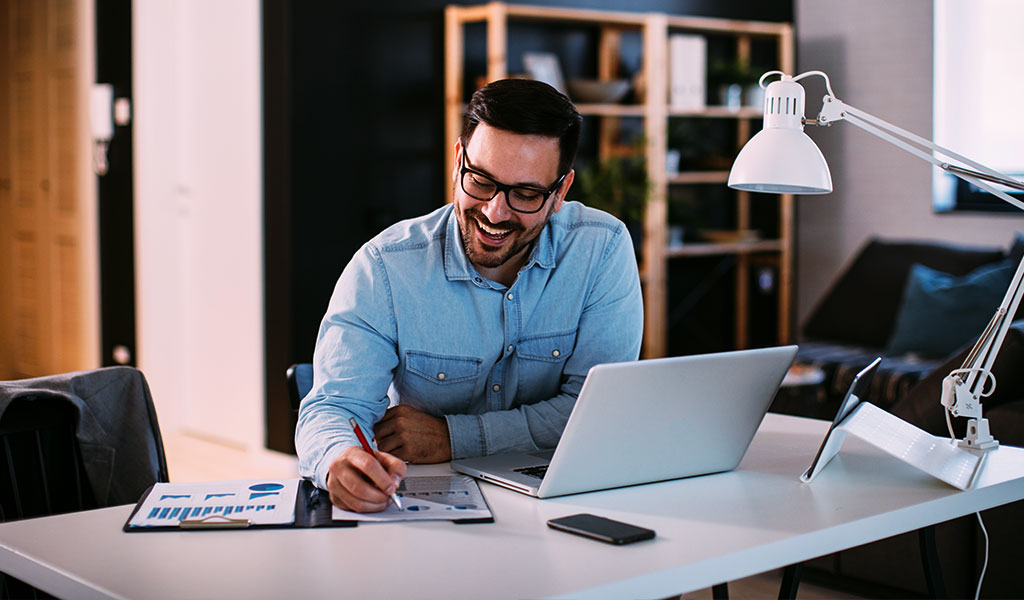 man working on laptop and analyzing data