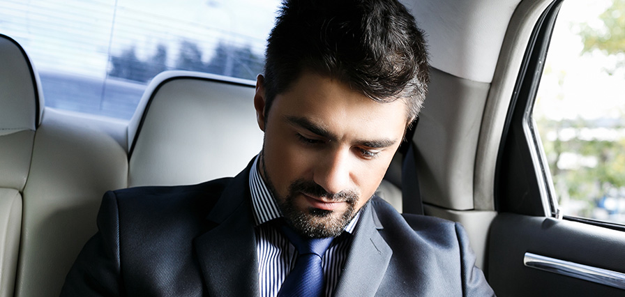 a businessman in his car