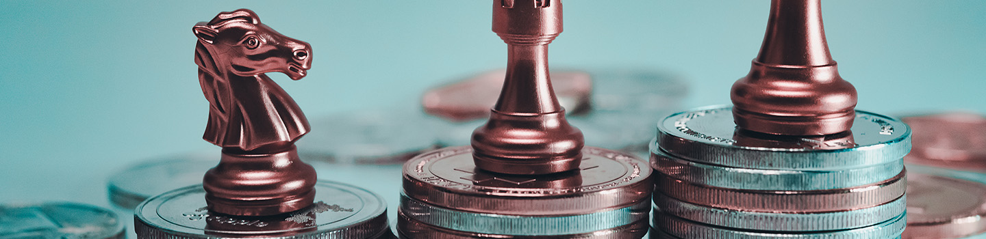 coins and chess pieces representing cumulative deposits  