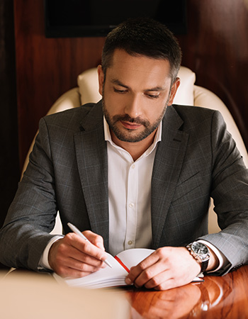 a man signing on a policy 