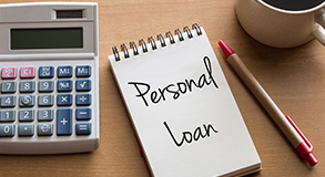 "personal loan"  written on a notebook 