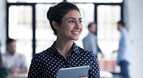 A woman having access to her account on her tablet 