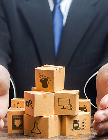 a business man arranging boxes with symbols 