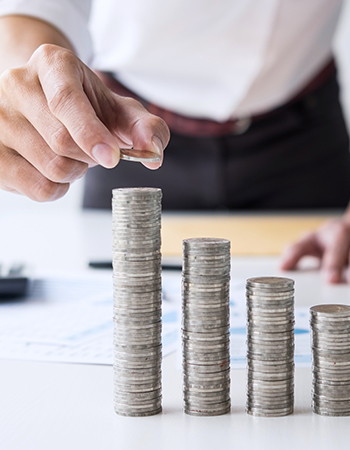 a business man collecting coins