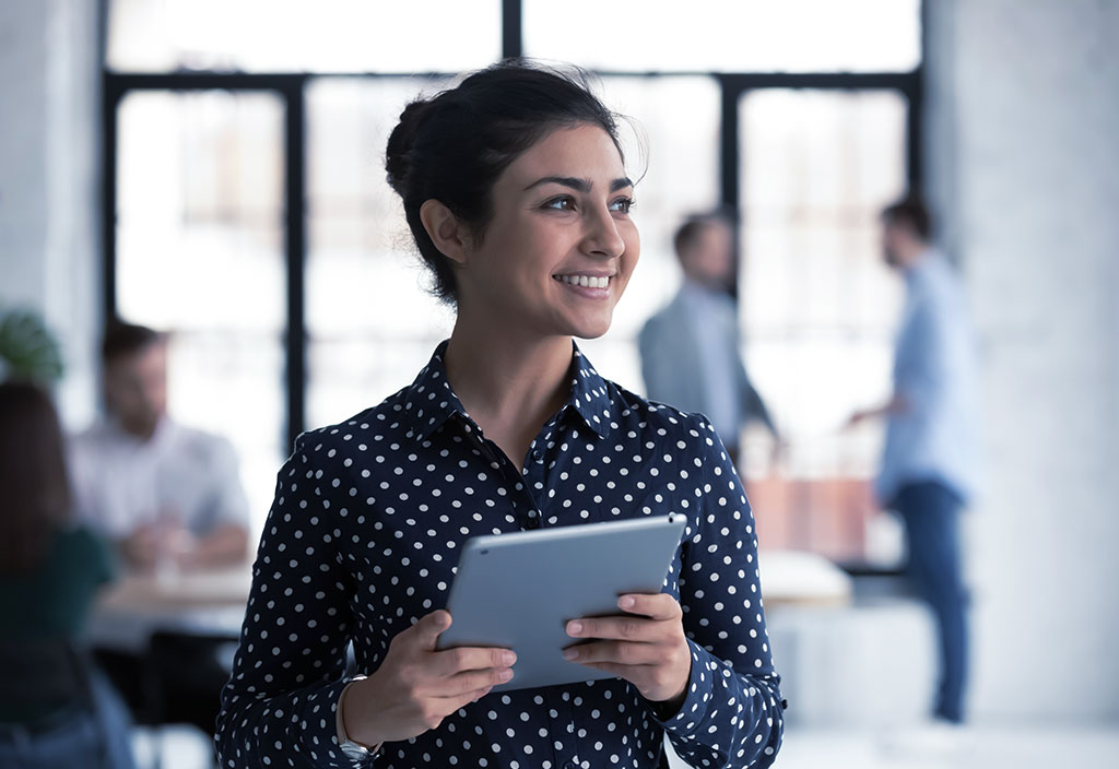 a woman accessing accounts details on her tablet 