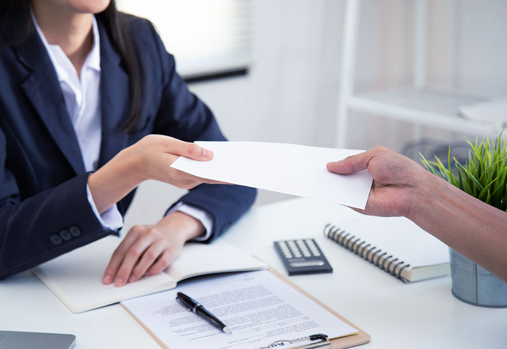 a bank employee delivering documents to a client